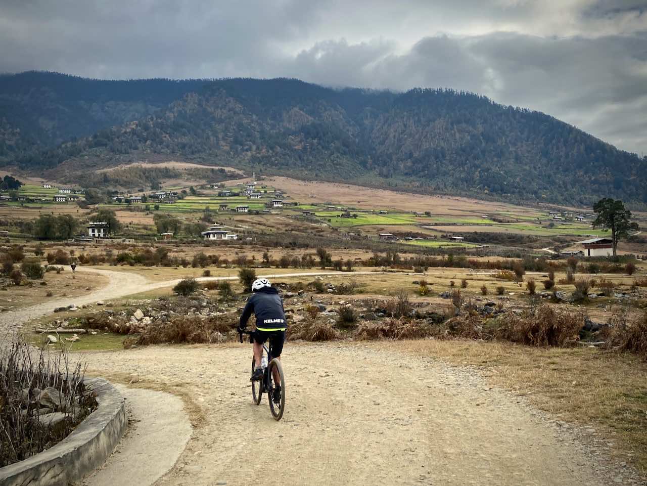 A cyclists on a gravel road in Bhutan