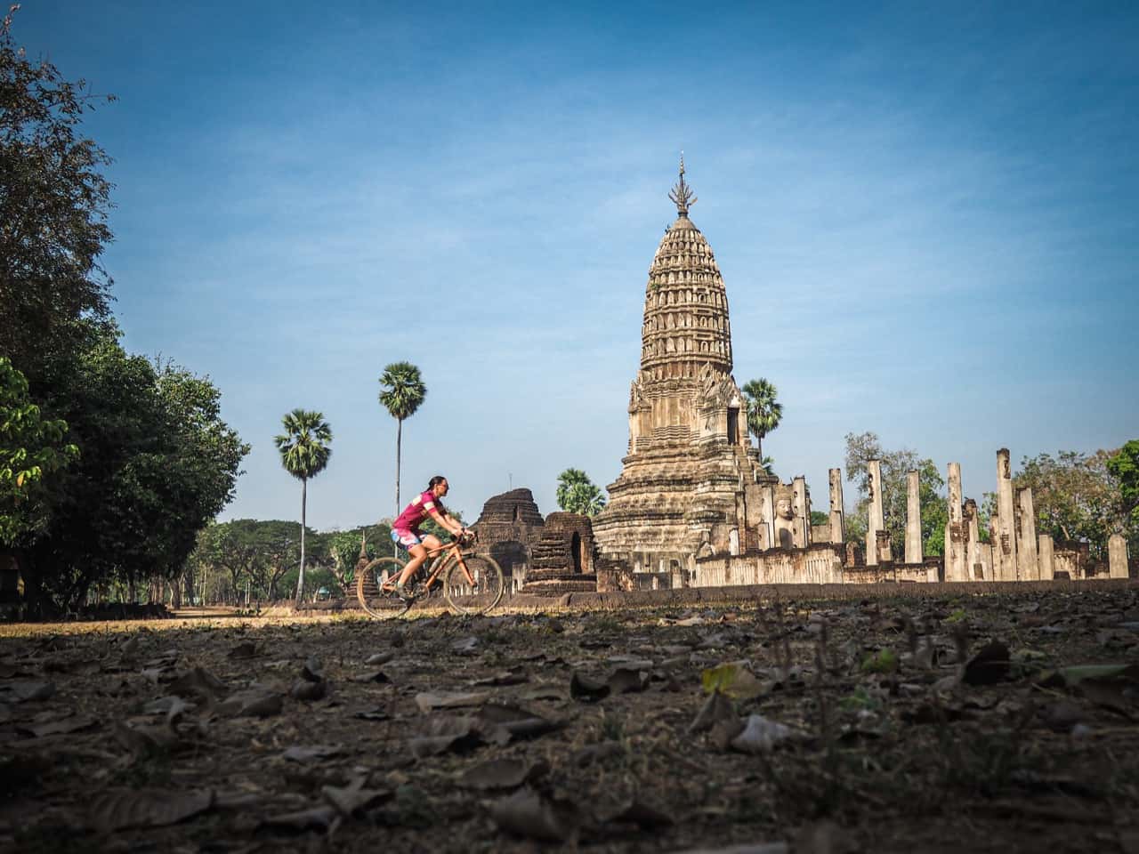 passing an ancient stupa whilst on gravel cycling tour in Thailand