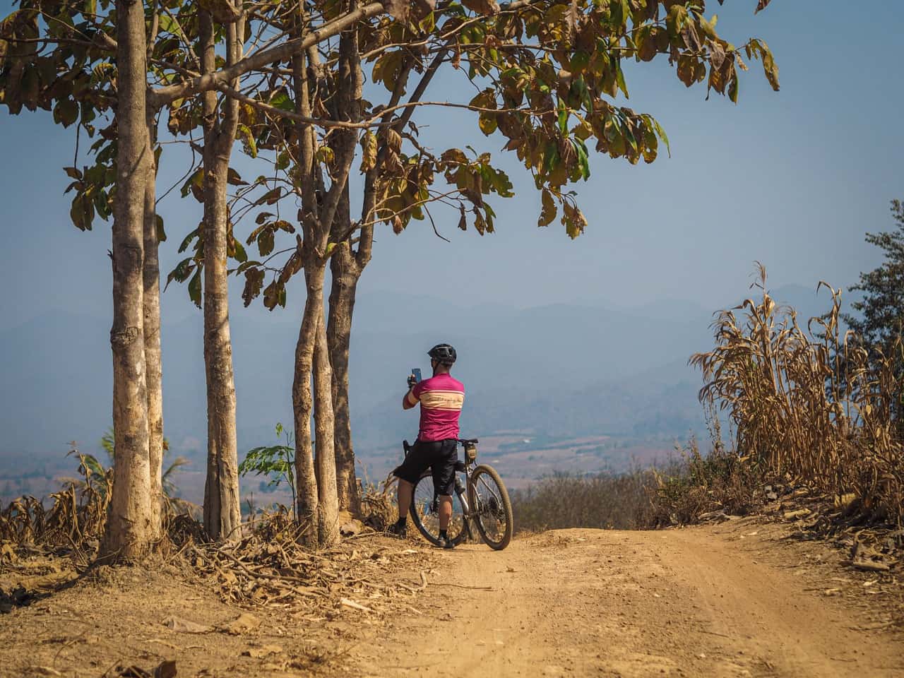 gravel cyclists photographing view in Thailand
